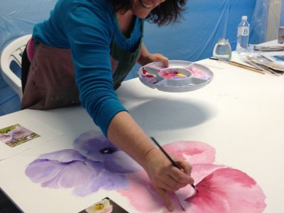 Artist painting 'Botanica' at Raymond Terrace
